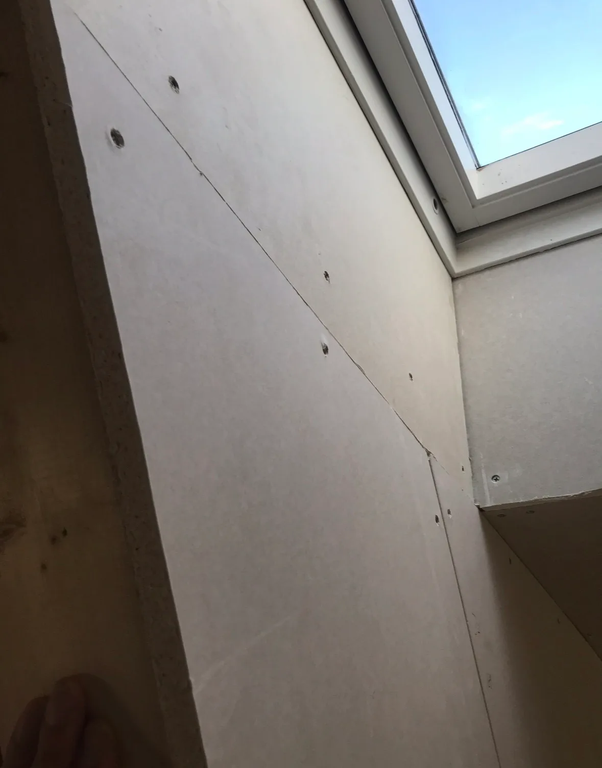Drywall interior with installed skylight