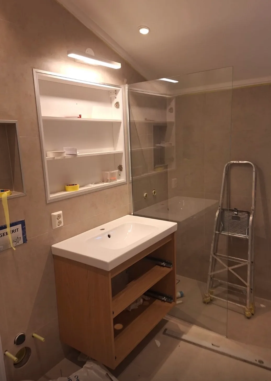 Modern bathroom with sink, shower enclosure and fixtures