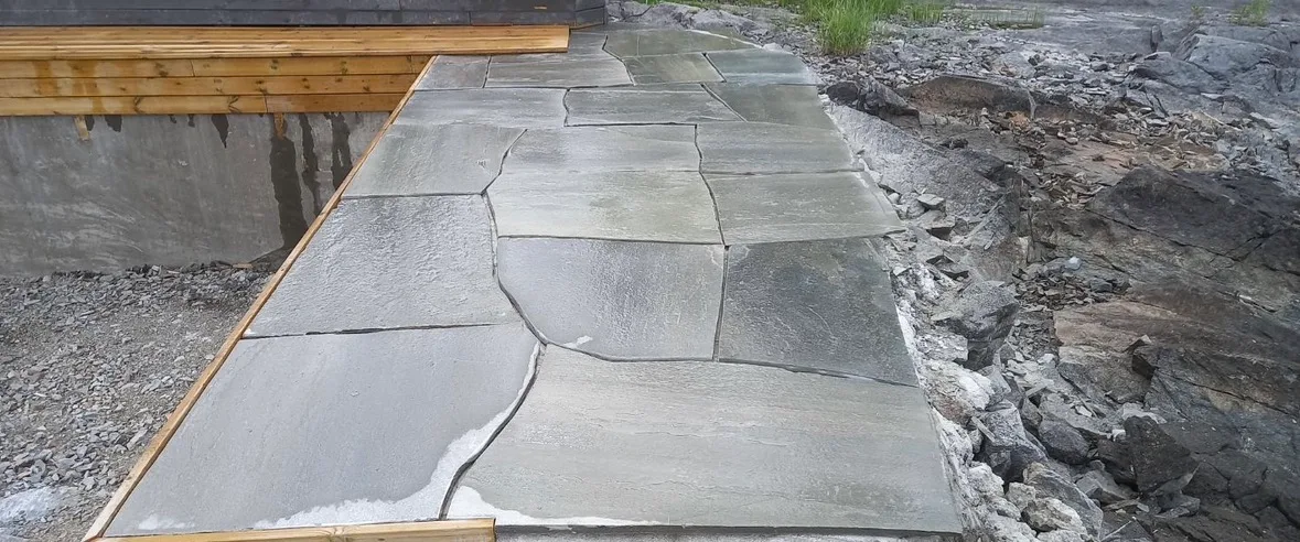 Freshly poured concrete terrace with stone tiles